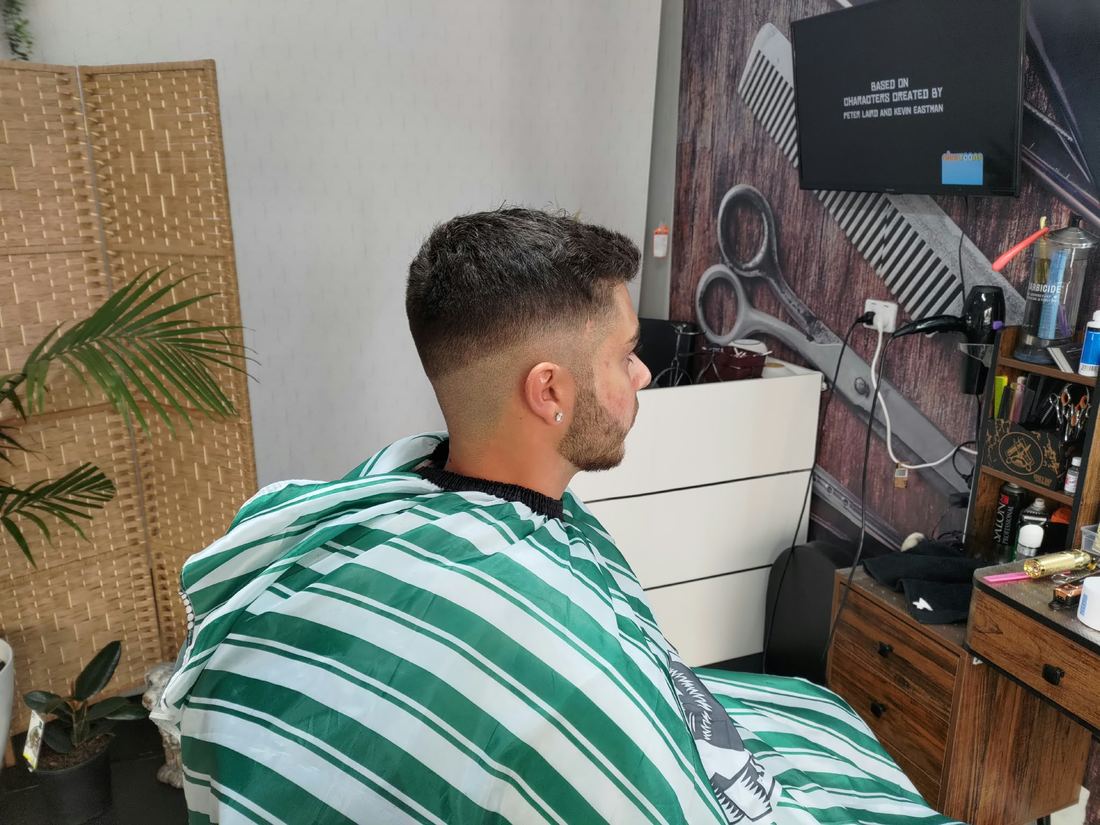 Low fade with a short textured top